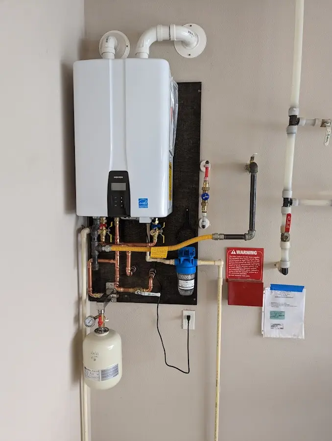 Professional plumber installing copper piping in a Van Alstyne home